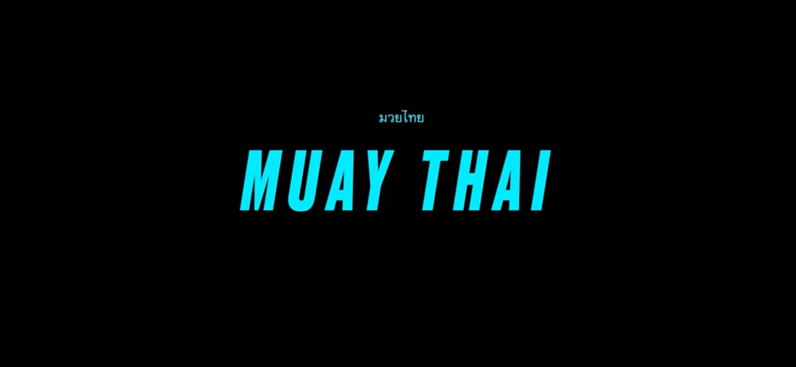 Black background with the words Muay Thai in large blue letters centered Above Muay Thai smaller text in Thai script