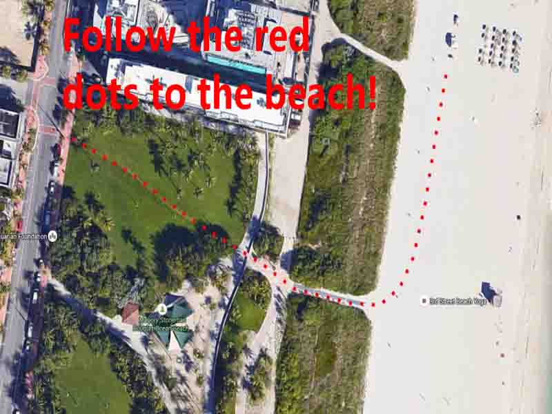 An aerial view of a park adjacent to a beach with a dotted red line showing the path from the park to the beach Text over the image reads Follow the red dots to the beach